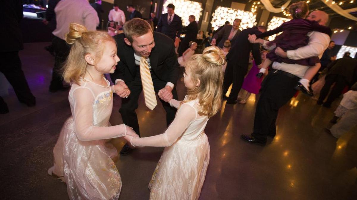Families dance during the annual Daddy Daughter Dance on at Compass Center in Grapevine. This year’s theme was Cinderella’s Royal Ball and featured appearances by Cinderella, Prince Charming and the evil Step Sisters.