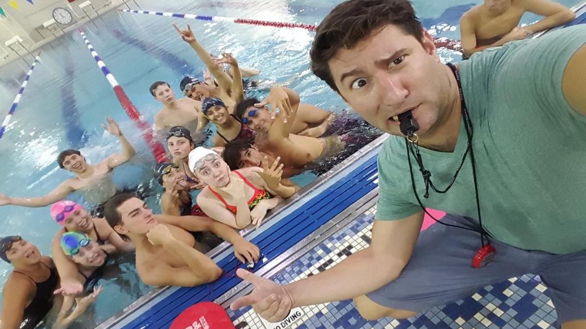 New Trinity swimming coach Richard Campanaro and his swimmers take a lighthearted selfie.