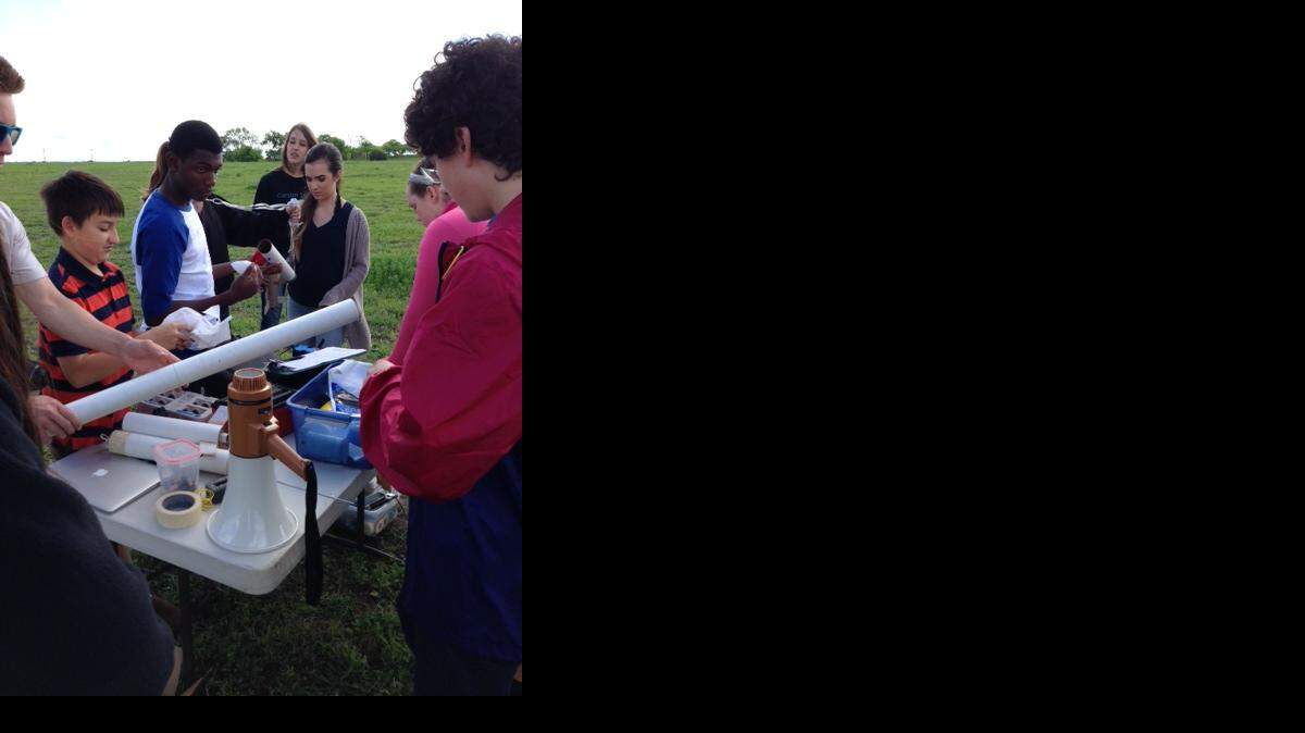
Students from The Clariden School in Southlake prepare their rocket for launch in a field in Frisco.
