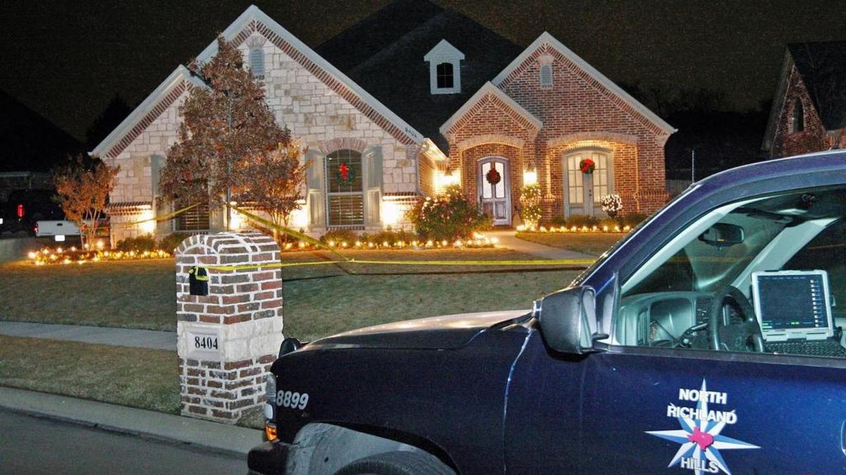 North Richland Hills investigation vehicles sit outside the home where a 68-year-old woman was fatally shot Dec. 9, 2007, by a man who knocked on the door.