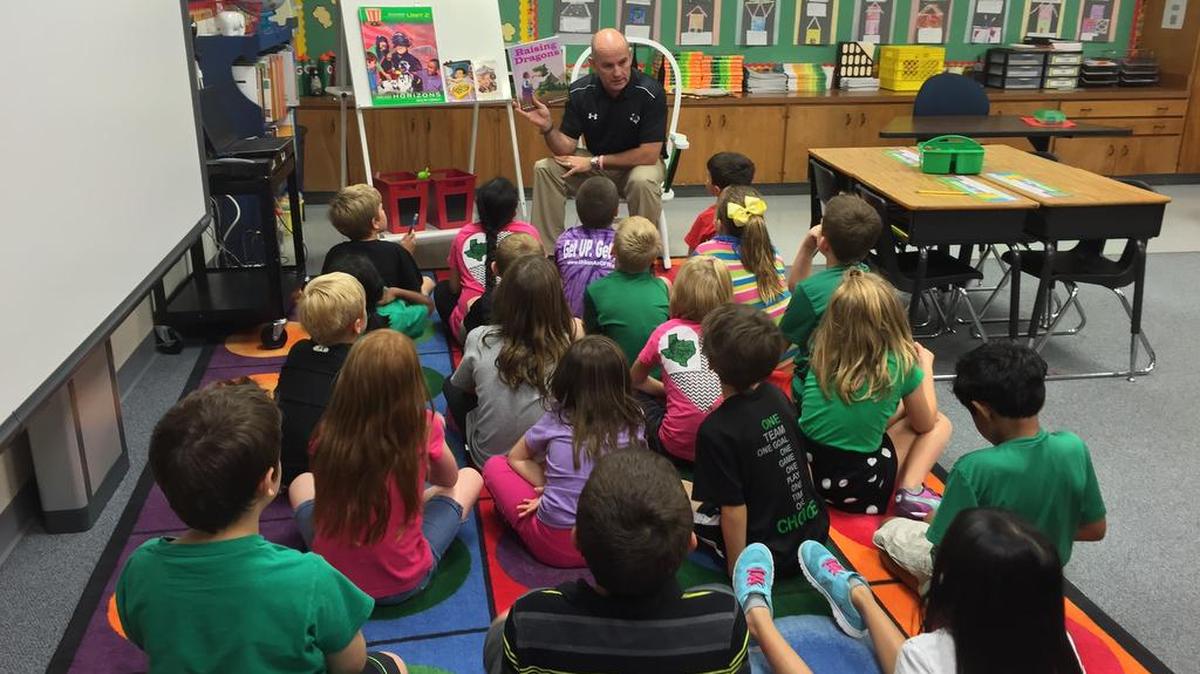 Carroll Superintendent David Faltys read to students at Johnson Elementary last fall. Crowding at Johnson and several other schools is addressed in the future bond recommendations.