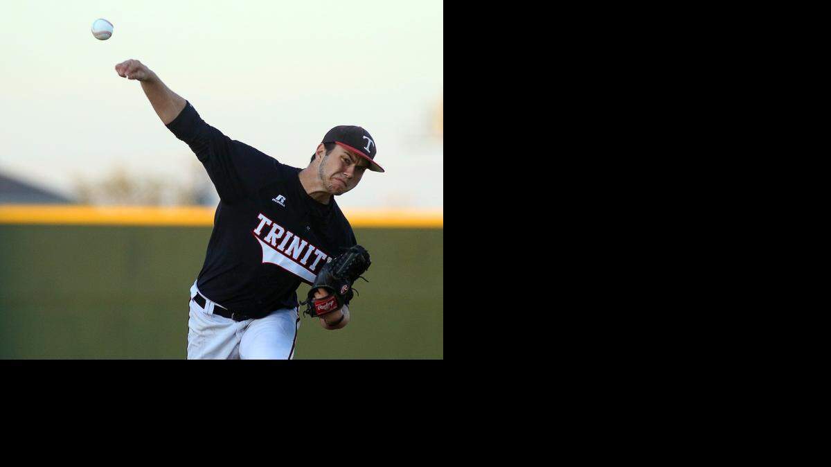 
Trinity Trojans pitcher Mark Geisel delivers to the plate against the Colleyville Heritage Panthers on March 23.
