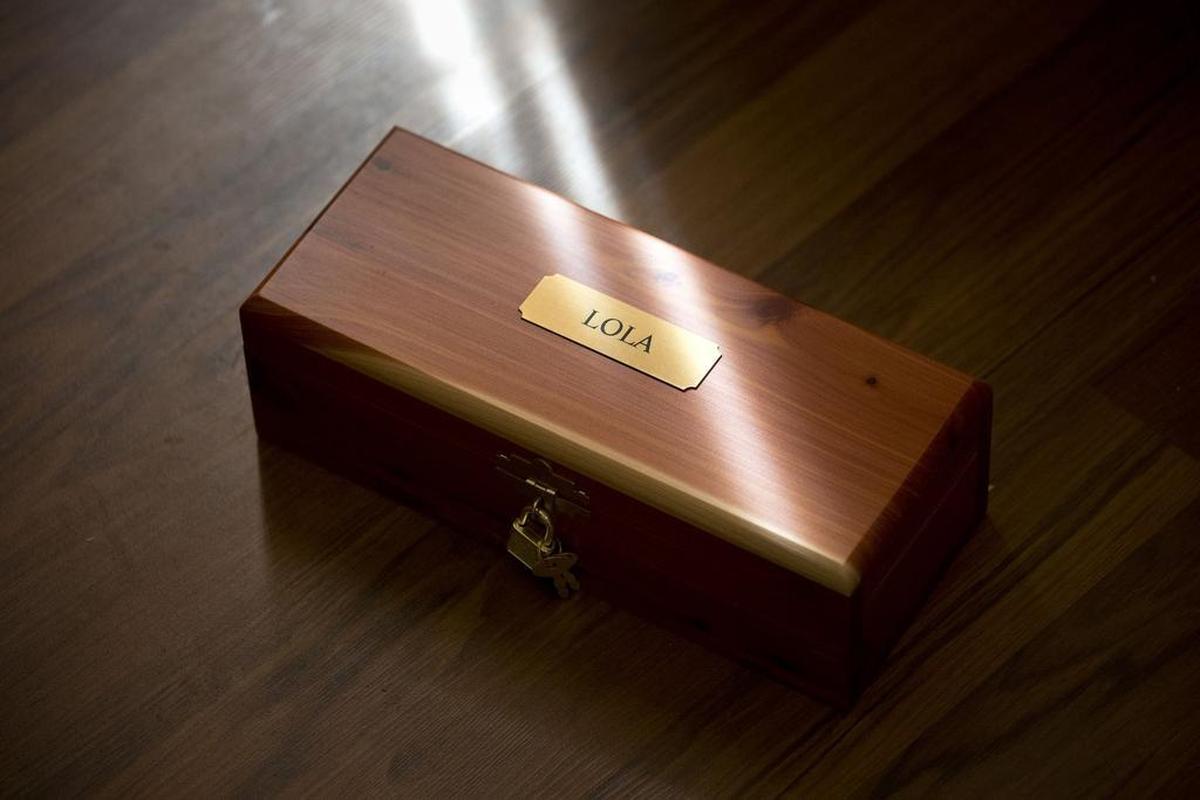 The cremated remains of Haeger Long's dog, Lola, at his Keller home.