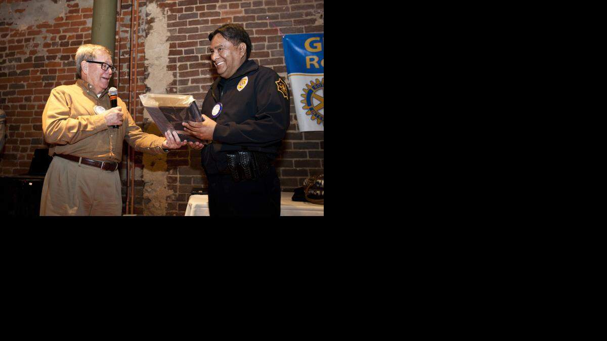 
Grapevine Mayor Pro Tem C. Shane Wilbanks hands a framed badge to Police Chief Eddie Salame on January 7, 2015 at the Lancaster Theater. Grapevine Chief of Police Eddie Salame was recognized by city leaders and his department for his 10 years of service as a police chief.



