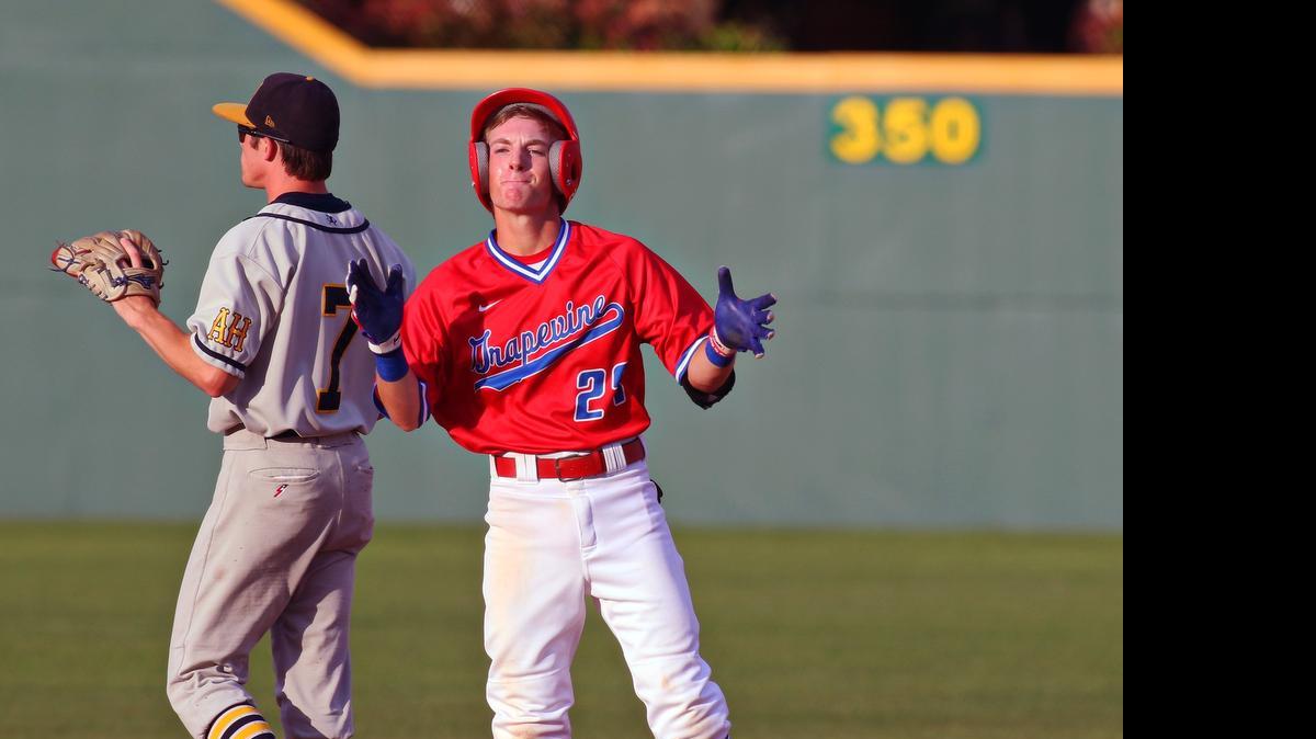 
Grapevine’s Antonio Lima (27) claps at secnd base after a double against Arlington Heights last season. Lima was named the District MVP.
