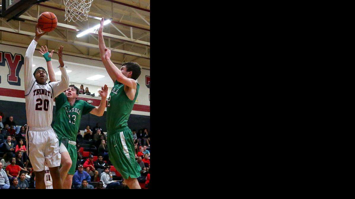
Trinity forward C.J. Bird (20) takes a shot against Southlake Carroll in recent play. Bird has been one of the top two scoring threats for the Trojans.
