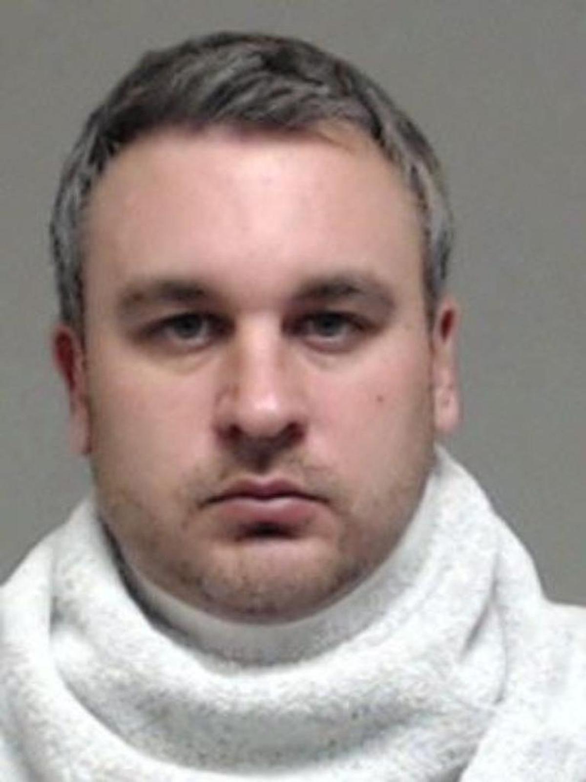 Charles Kyle Adcock, who faces 29 charges of sexual abuse of a child, resigned from a Bedford church Thursday.