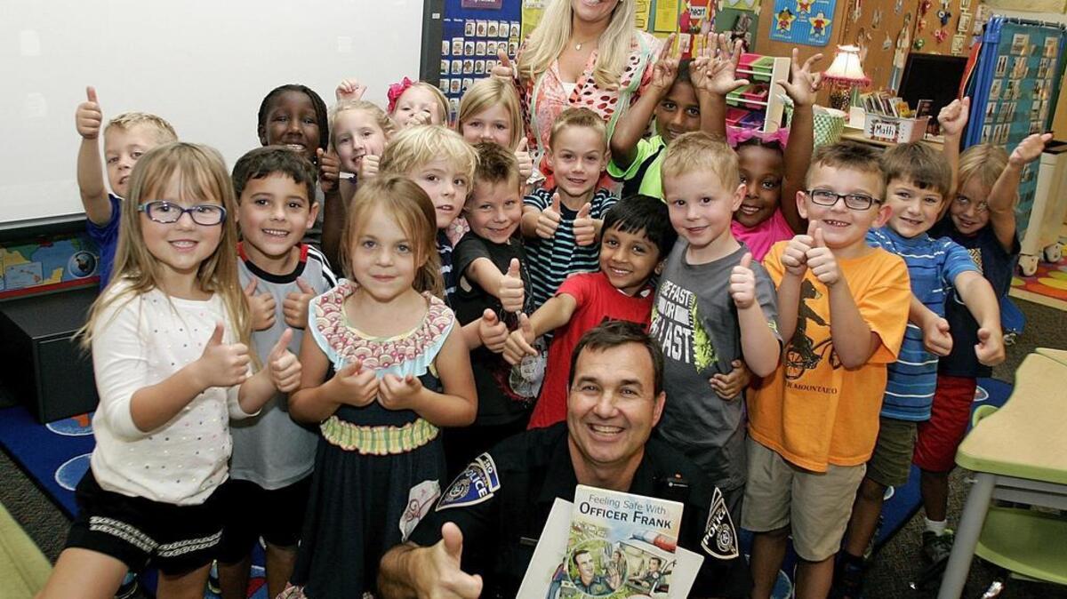 
Southlake SRO Frank LaGrassa with Tracey Hatfield and her kindergarten class at Walnut Grove Elementary School. 
