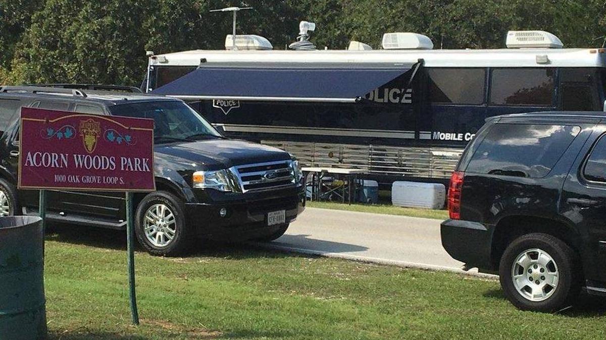 Police work at the scene of where a body was found burned and dismembered early Wednesday.