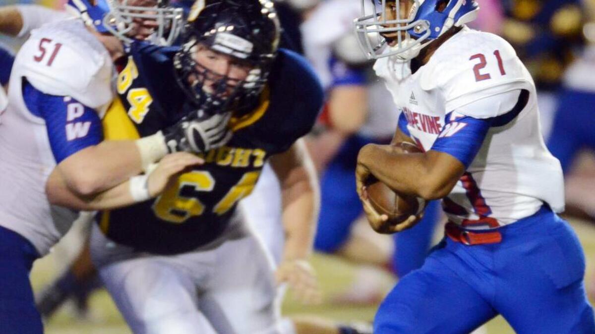 
Grapevine's Jacobi White, right, races out of the backfield against Arlington Heights in last week’s win.
