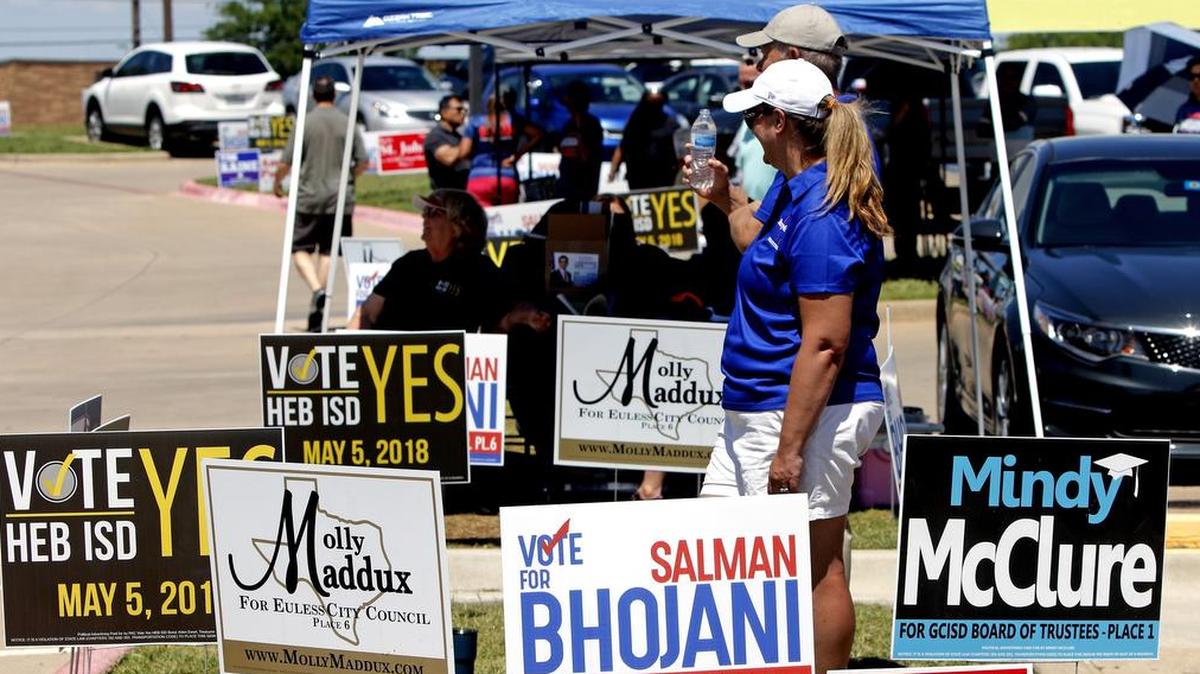 Canopies and political signs filled the parking lot across from the Euless library during the local election on Saturday.