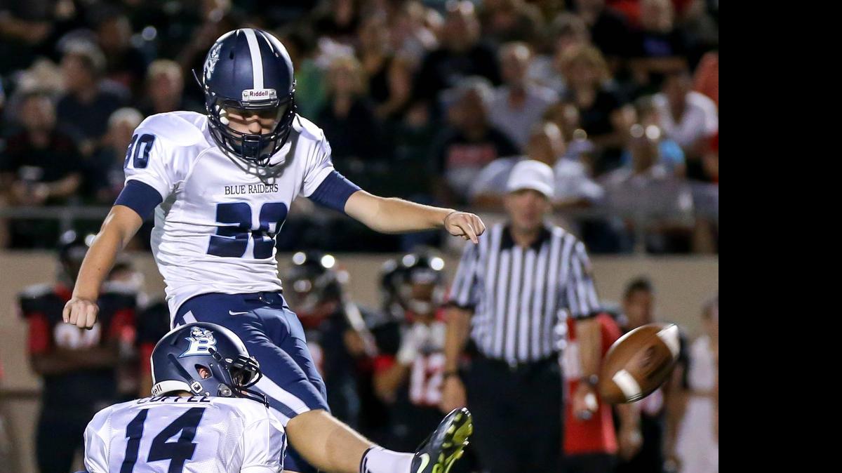 
L.D. Bell kicker Tyler Dunlop tries for a field goal against Trinity last season.
