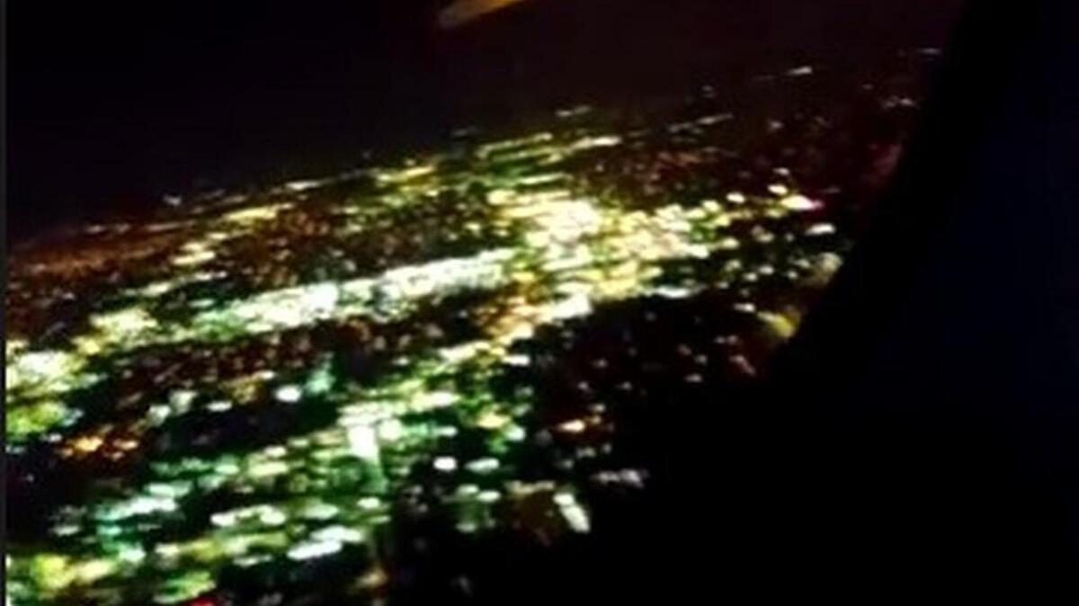 An American Airlines passenger posted a short video from inside the plane showing flames shooting from the aircraft.