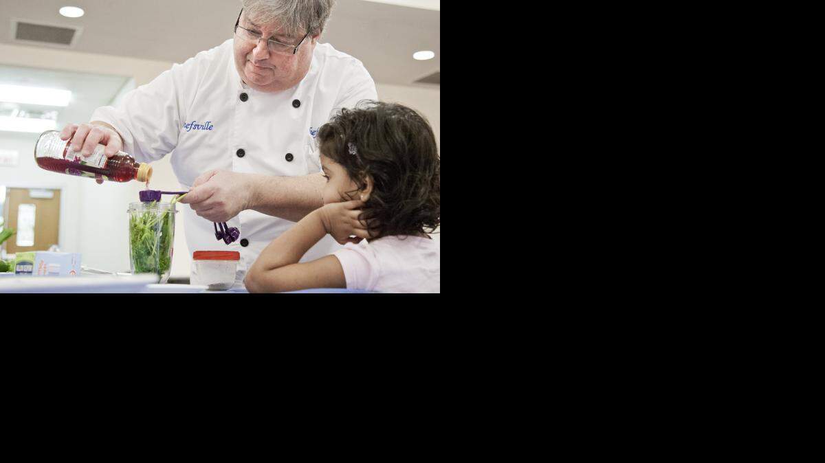 
Chef Scott Horwitz shows kids how to make chimichurri sauce on Saturday at Grapevine Library. 
