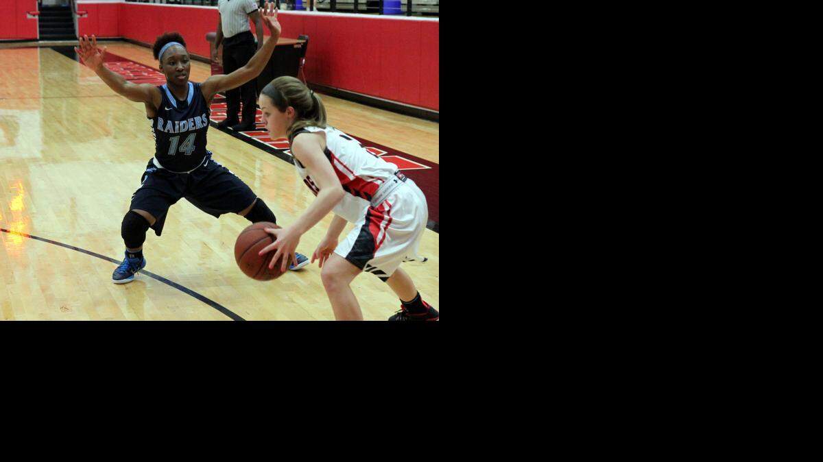 
Alexis Baston, No. 14, guards a Colleyville Heritage player in a district game earlier this month. Head coach Brock Pembleton said Baston affects every aspect of the game.
