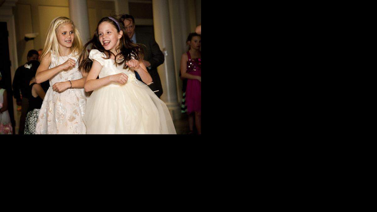 
Daisy Doddridge (left) dances with her friend, Kat Chinn (right), on Feb. 7, 2015 at Southlake Town Hall. The city hosted its annual Sweetheart Dance with live music, dancing, games, and free limo rides around the town square.
