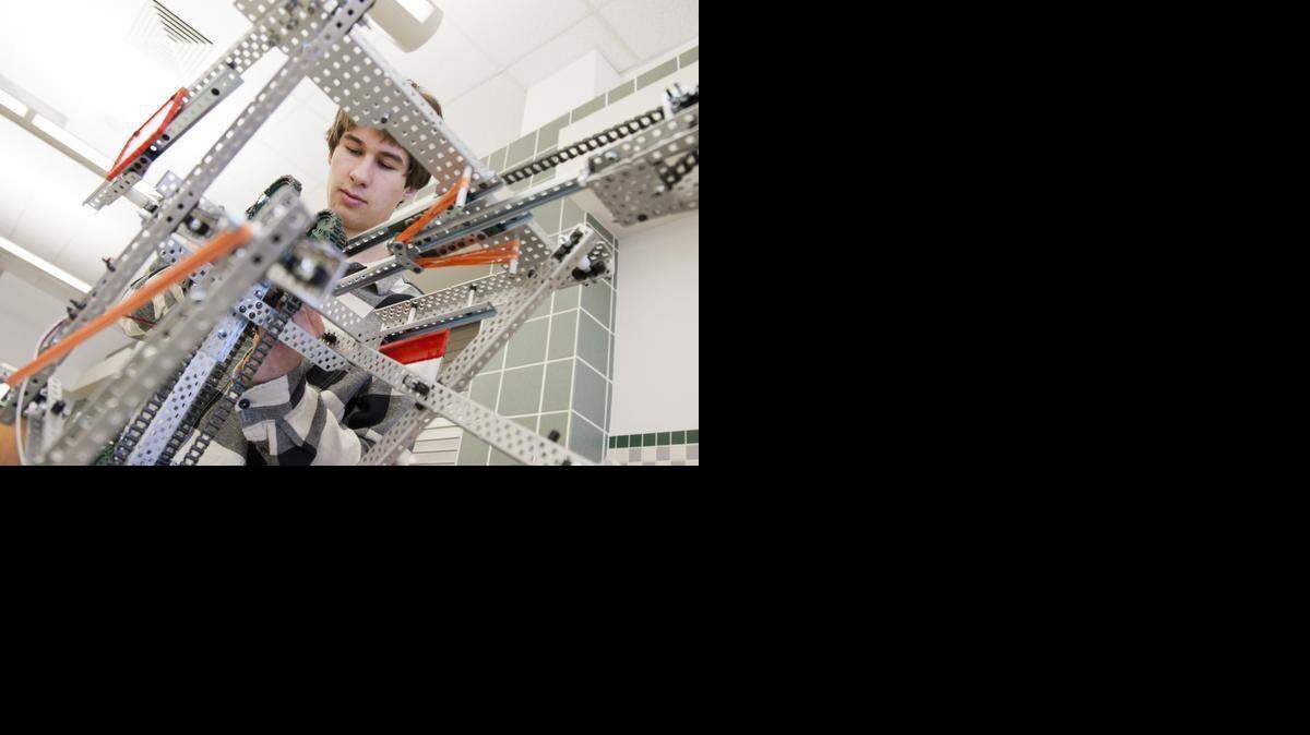 
Helping his team repair their robot is Parker Stutsman, of Keller High School. 
