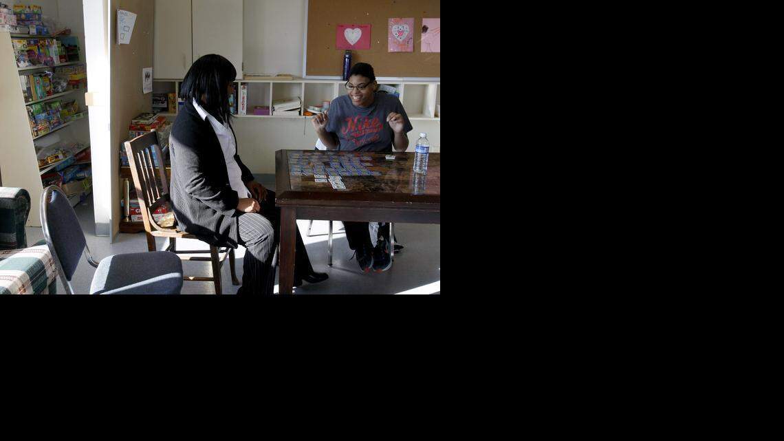 
Chantel Griggs, right, plays a game with assistant director Barbara Freeborn at the Clubhouse for Special Needs in Bedford.
