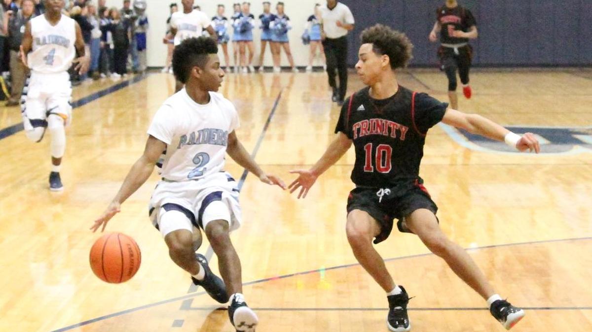 Bell junior Ondre Lacey, left, races Trinity’s Elijah Crawford in district play. Lacey is among the players expected back next year.