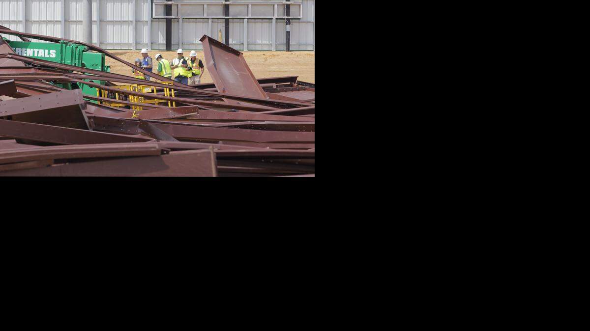 
Investigators survey the scene after a building under construction at Argyle High School collapsed early on the morning of April 2.
