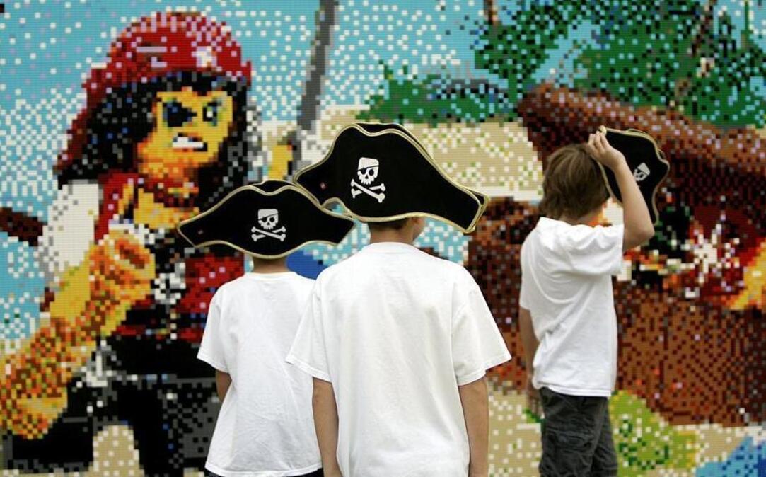 
Creative Crew members weather the rain to see the Pirate Beach Wall Mosaic at Legoland Discovery Center at Grapevine Mills mall earlier this month.

