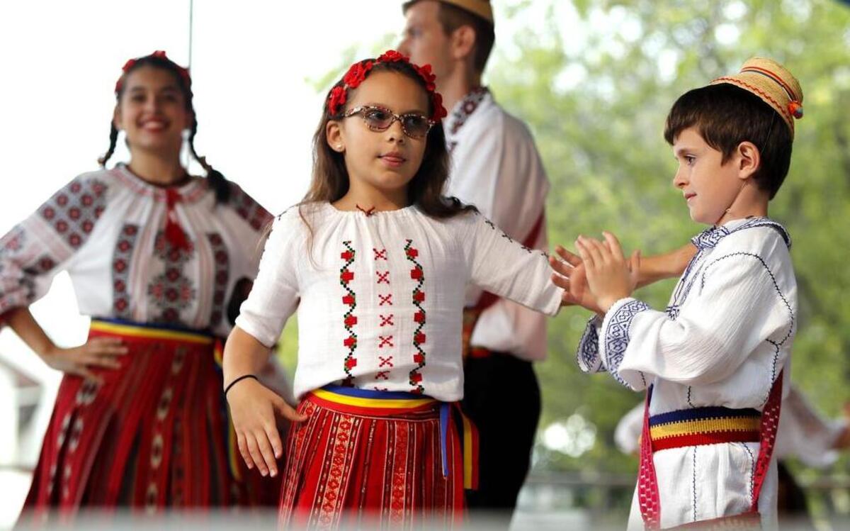 Andrew Bucur and Larisa Inocan perform traditional Romanian folk dances. They are dancers with the Tricolorii Veseli Juniori group.