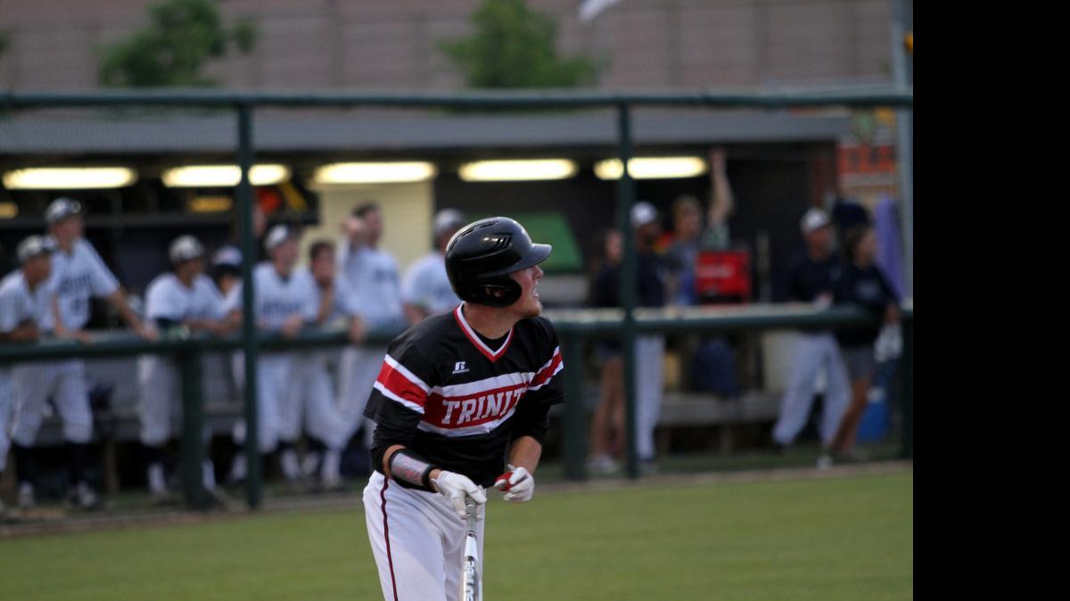 
Trinity’s Wes Engle watches his solo home run clear the wall and tie the game in the first match against Flower Mound last Thursday.

