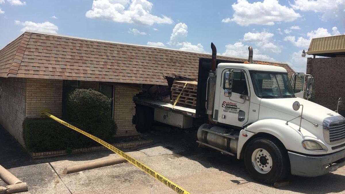 A flat-bed truck crashed into the Harwood Road Pet Hospital on Friday.