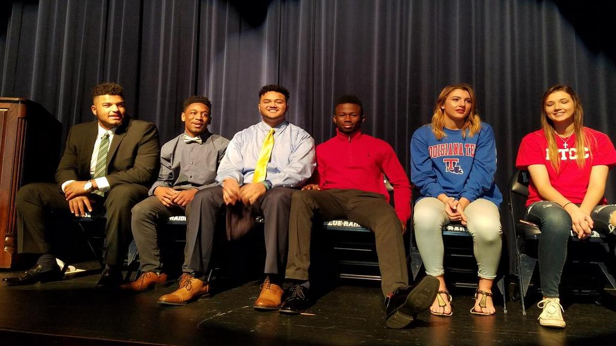 From left, Brendon Weatherspoon, Ivan Traylor, Donovan Gladden, Devunte Dawson, Savannah McGill and Mackensi Mankel on National Signing Day.