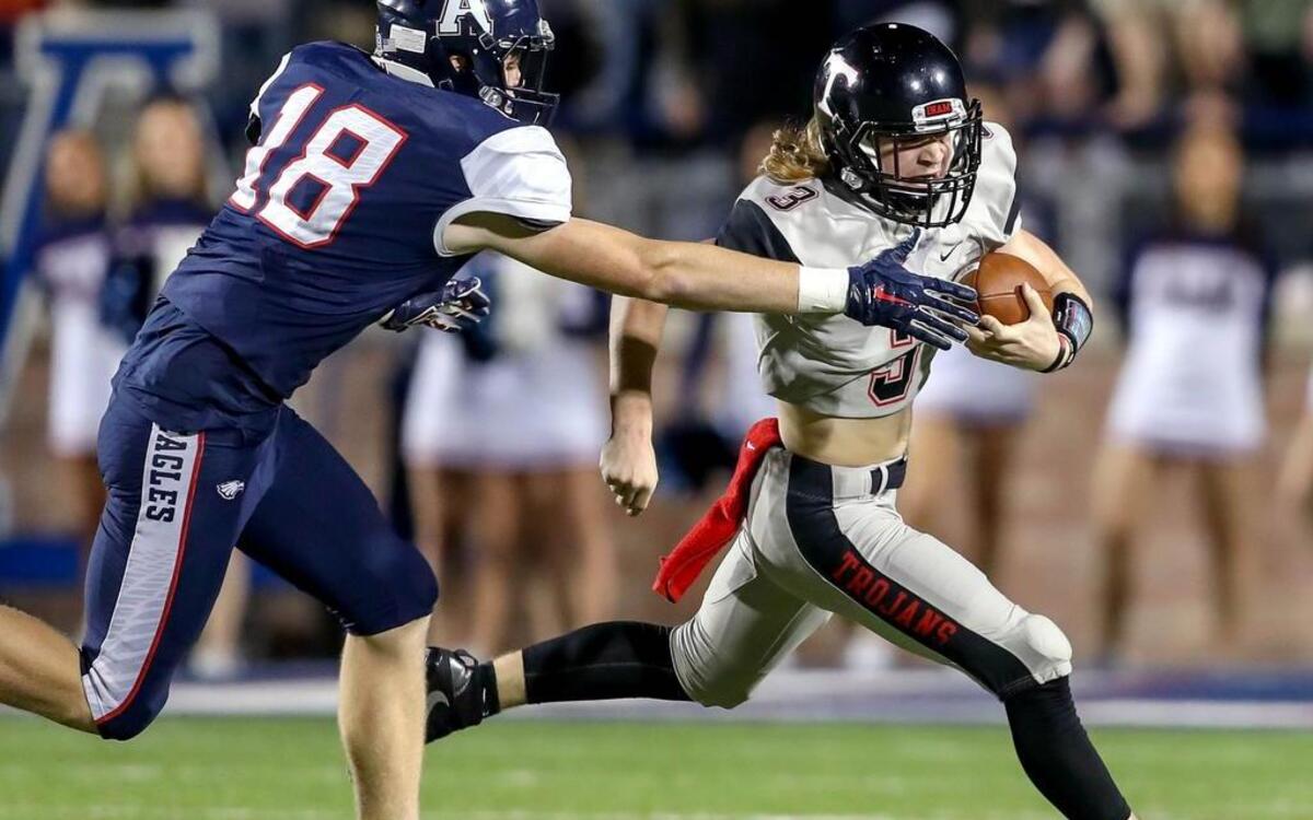Trinity QB Noah Wineteer eludes an Allen defender in the Trojans’ loss last week. Wineteer said the season would have been fun even if they hadn’t won a game.
