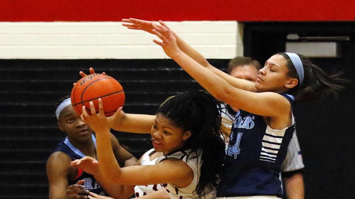Trinity Oliver (3) makes a steal on Lexi Gordon in a 2015 matchup. The pair will probably never face one another again at the high school level.