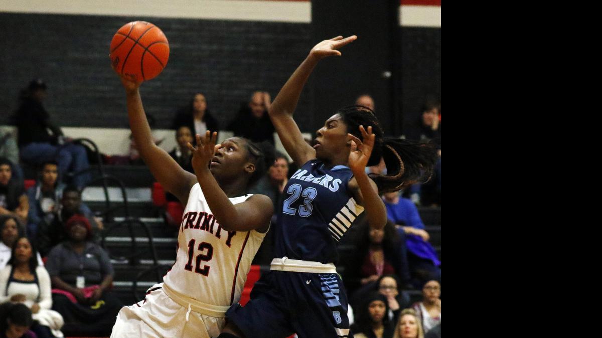 
Trinity’s Kayla Hunter (12) shoots last season against L.D. Bell.
