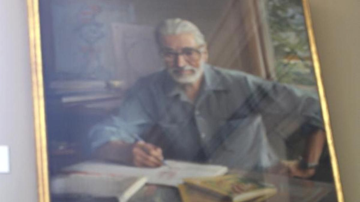 A portrait of Dr. Seuss with the book What Pet Should I Get? that was discovered after his death in 1991.