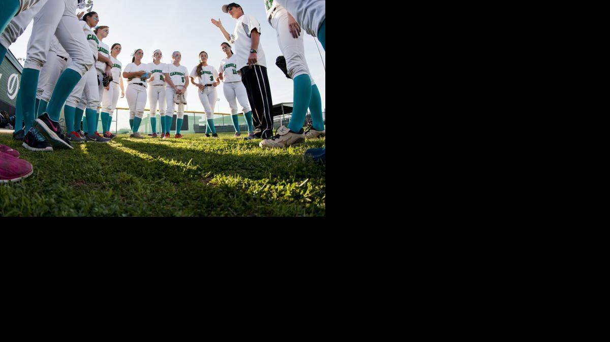 
Carroll's varsity team gets a pep talk before the Teal Out Friday at Carroll Senior High School. 
