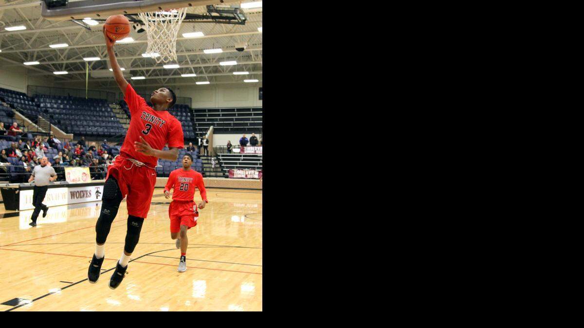 
Jacob Jackson goes for a lay-up against Cedar Hill last Wednesdays. The Trojans led by as much as 25-8 at one point but lost, 65-53.
