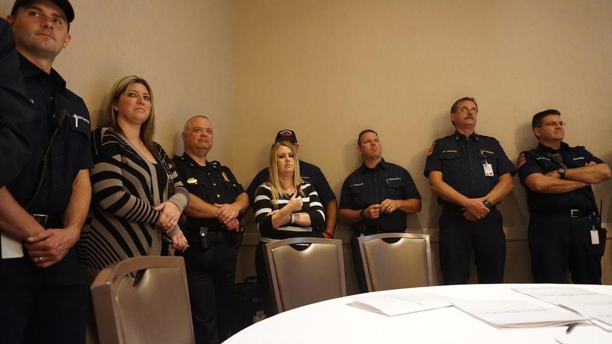 Bedford firefighters listen as city officials hear the news that Bedford was among the first cities in Texas to receive the HeartSafe award for its efforts to promote healthy lifestyles and help improve the survival rate after someone suffers a heart attack.