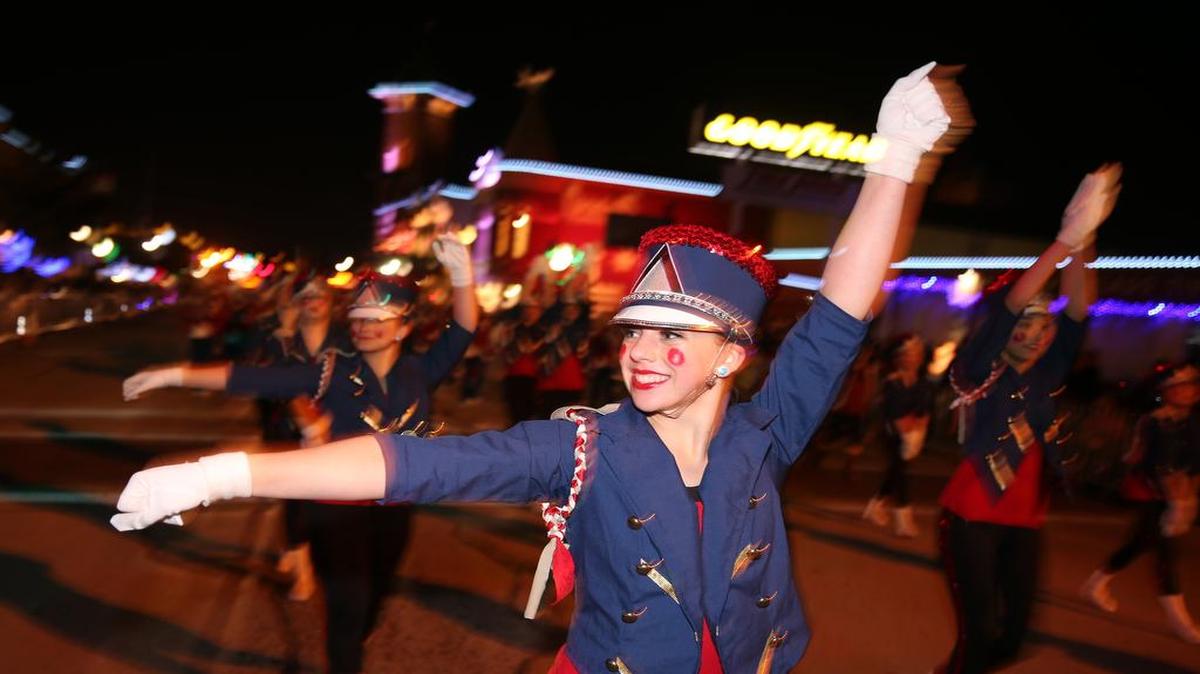 Keaton Taylor of the Grapevine High School Mustang Belles marches in the Grapevine Parade of Lights. The annual parade began in 1979.