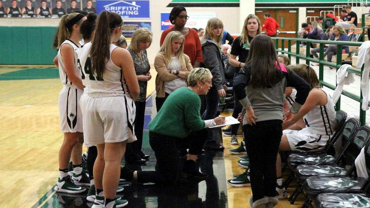 Carroll head coach Teri Morrison (center) is shown coaching her team in this file photo. Morrison resigned as head coach after 29 years Tuesday, Feb. 13, 2018.