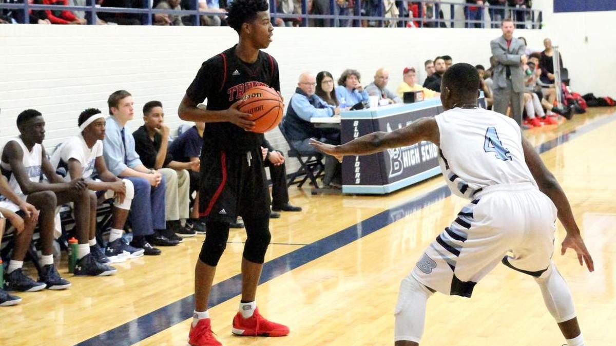 Devin Newton, left, plays in memory of his brother DeShawn, who died after suffering an asthma attack in a basketball game in 2008.