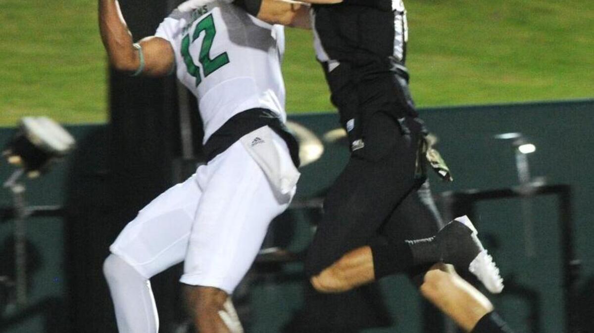 
Southlake Carroll's Zach Farrar, 12, catches a pass and scores a touchdown against Abilene last week.
