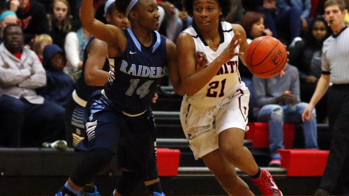 Lady Raiders Alexis Baston, left, vies against Trinity’s Haleigh Talbert last season.