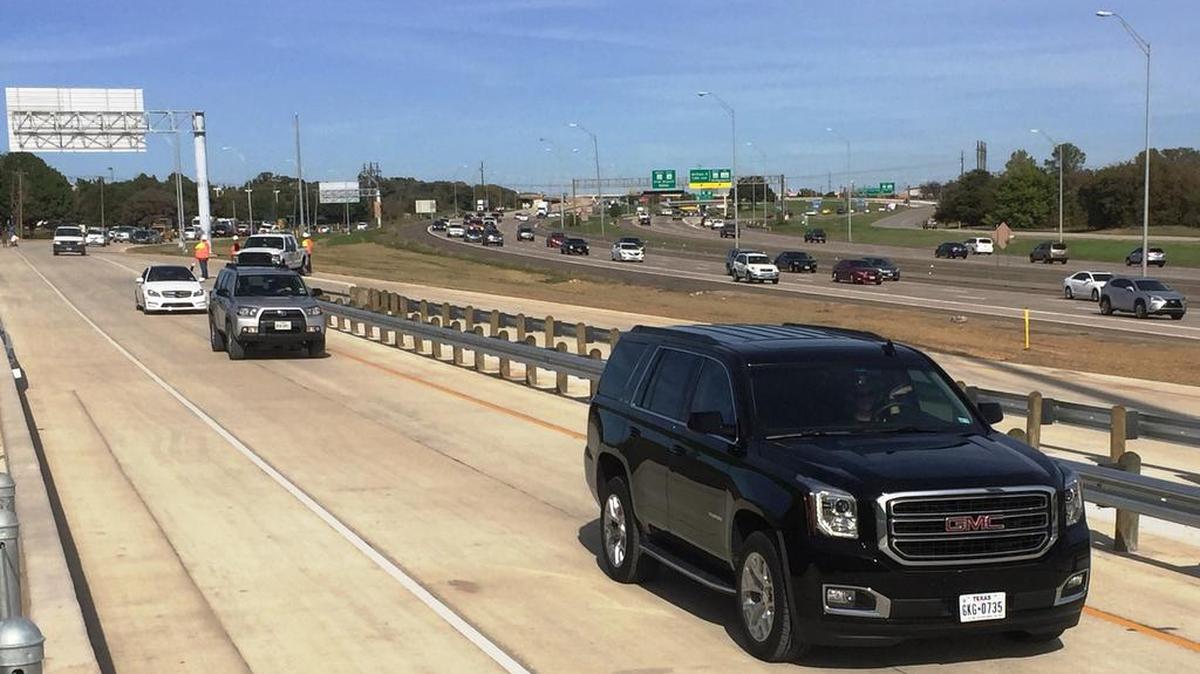 The first wave of vehicles uses the new Texas 121 southbound on ramp at William D. Tate Avenue Thursday afternoon in Grapevine.