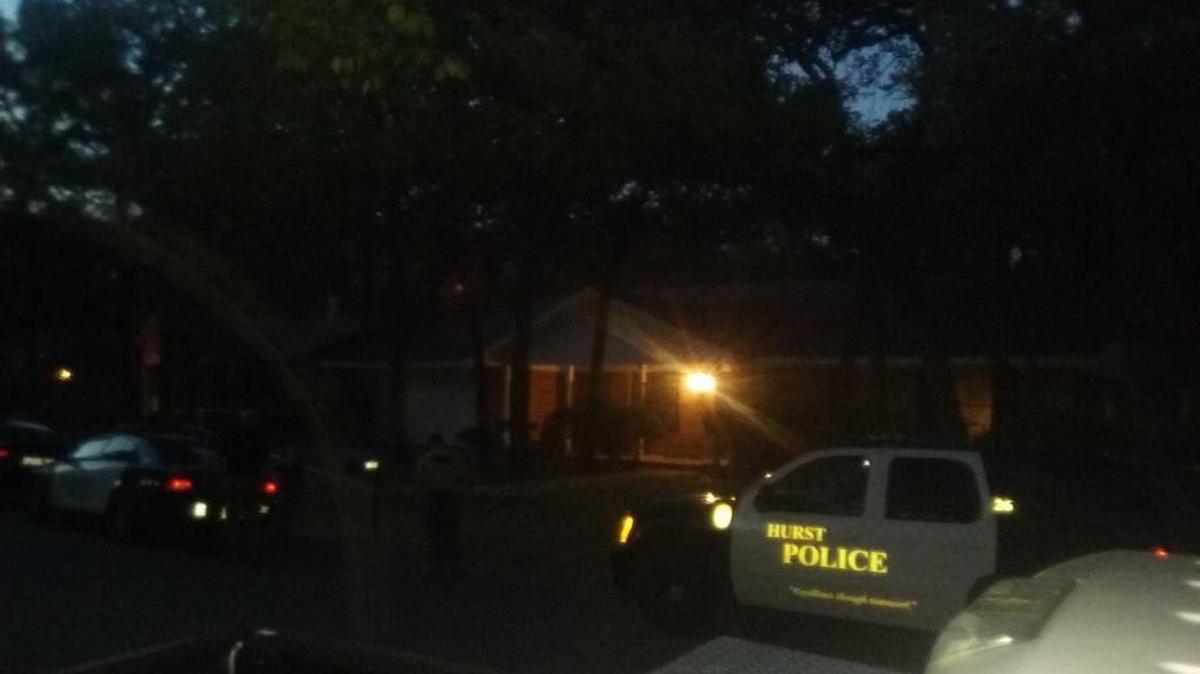 
A Hurst police officer shot a domestic violence suspect in behind this house in the 1300 block of Redbud Drive. 
