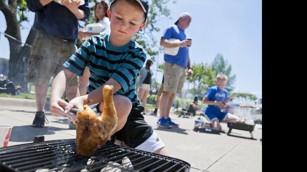 
Landon Walling competes in the kid’s barbecue challenge Saturday at the Colleyville Center. The city hosted its annual Old Tyme BBQ with proceeds going to Special Olympics.
