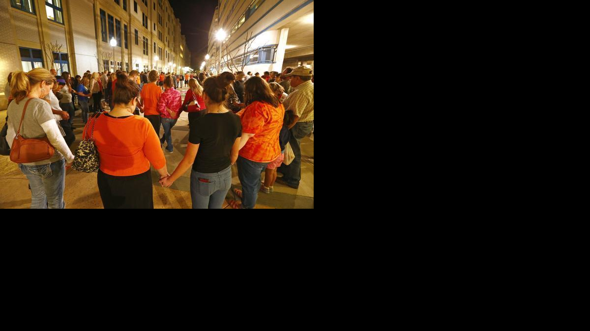 
People pray during a vigil for Samuel Ramon Wednesday night in Fort Worth. The family of Ramon, 16, organized the vigil at Cook Children's where Ramon recently had another in a series of heart surgeries Wednesday, Jan. 28, 2015. 
