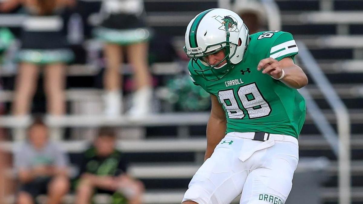 Southlake Carroll kicker Kole Ramage kicks the ball to Union in the season opener.