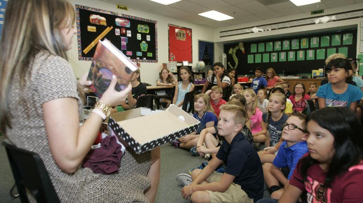 Rickie Keim talks to students about her favorite book for the first day of school at Jack D. Johnson Elementary in Southlake Aug. 22, 2016.
