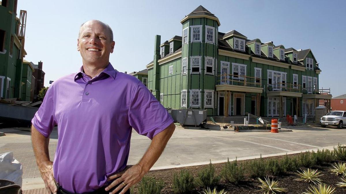 
Southlake Town Square developer Frank Bliss stands in front of new construction at the popular retail, residential and municipal center.
