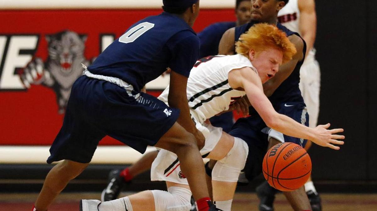 Colleyville Heritage Panthers guard Nantz Nelson, center, has two older brothers who played for the team.