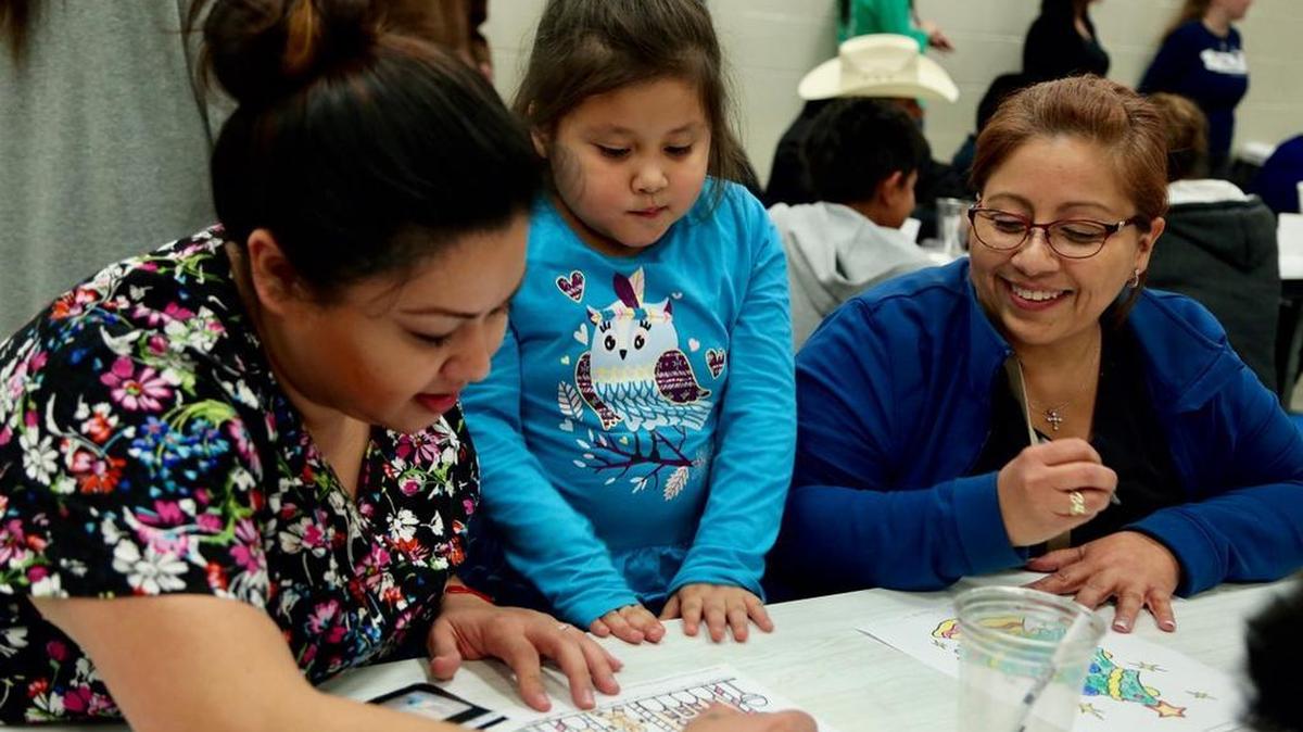 Children and parents gathered Monday for a special Christmas party called Night of Hope. Children made crafts to give to their parents and parents were given gifts and holiday meal fixings. The nonprofit 6 Stones sponsored the event.